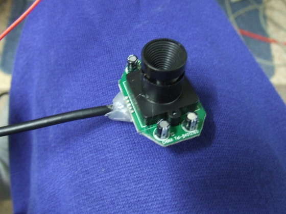 Just remove any screws and plastic cover that is not needed. This webcam cost me 5$ - very simple low resolution web cam.