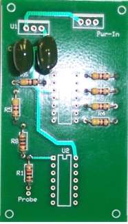 Place the (2) 150 nf (0.15 uF) capacitors onto the pcb and solder.