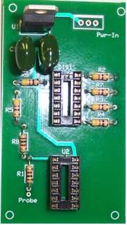 Add a 5 V Voltage Regulator IC, (2) 14 Pin DIP sockets, the Hex Inverter IC and the 7 Segment LED display components onto the pcb and solder them.