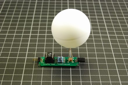 Drill a 4mm hole in the ping pong ball. Use a file to widen the hole a bit. Try to put it on the LED. Program the controller and insert it into the socket. Take care of the notch.