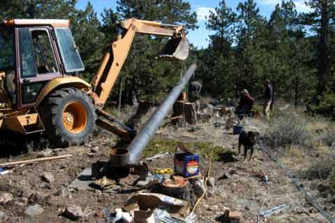 In this case we used a backhoe to pull the gin pole up.