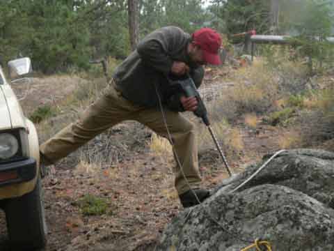  Into the granite we drilled 1 inch diameter holes 12 inches deep and used 1 inch diameter expansion bolts.