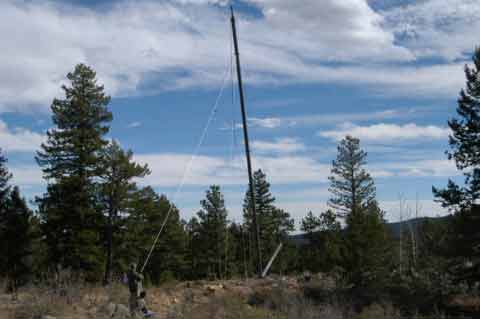 When raising, people need to pull on the rope as the tower gets nearly erect to overcome the weight of the gin pole