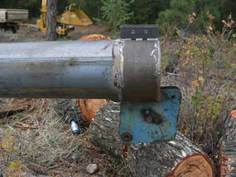 The end of the gin pole has accommodation for two guy wires to be anchored, and a large pulley at the end.