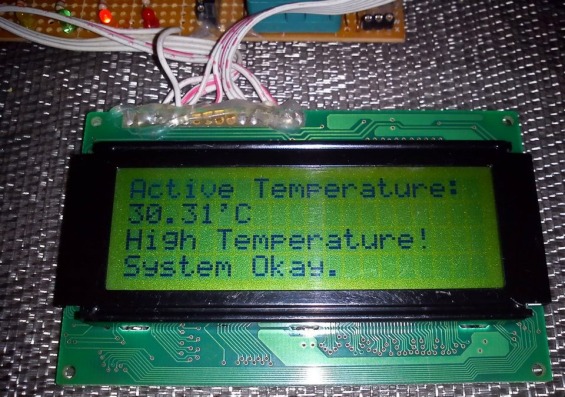 Интеллектуальный контроллер температуры: сообщение на ЖК индикаторе о превышении  установленного значения температуры.