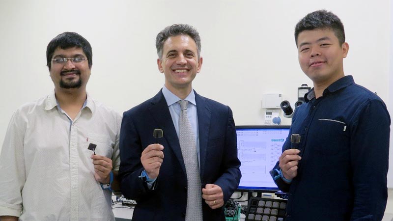 Associate Professor Massimo Alioto (centre) and his team have developed a smart microchip, BATLESS, which can self-start and continue to operate even when the battery runs out of energy. This novel technology could enable smaller and cheaper Internet of Things (IoT) devices.