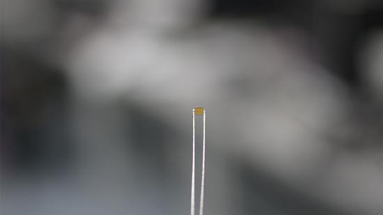 The BATLESS microchip can work from a tiny solar cell integrated into a crystal.
