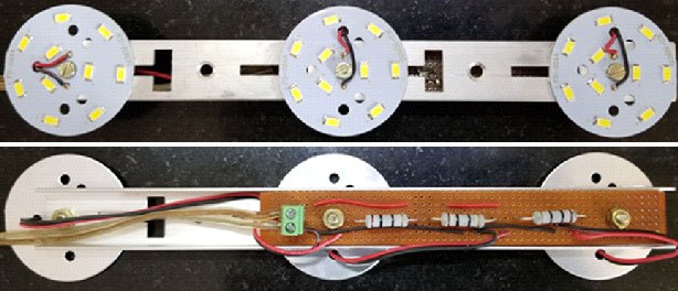 This photograph shows the top and bottom sides of the solar day lamp with 3 LED arrays.