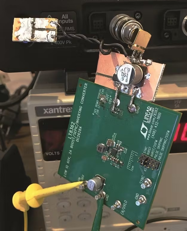 The benchtop setup of the clean phantom power supply using the DC2628 demonstration circuit shows the added-on filter.